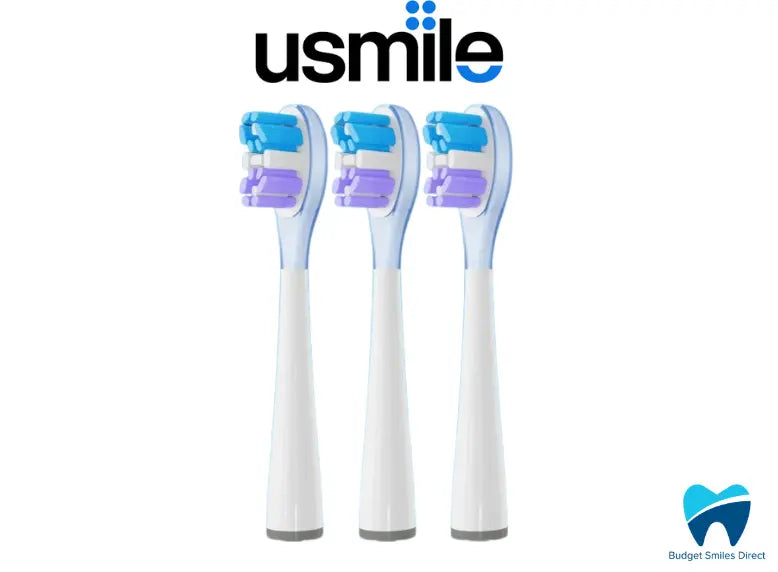 Three white electric toothbrush heads with blue bristles on a white background, featuring the Usmile brand.