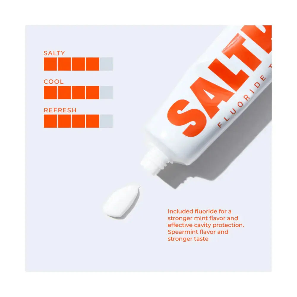 Saltrain fluoride toothpaste tube on a light grey background