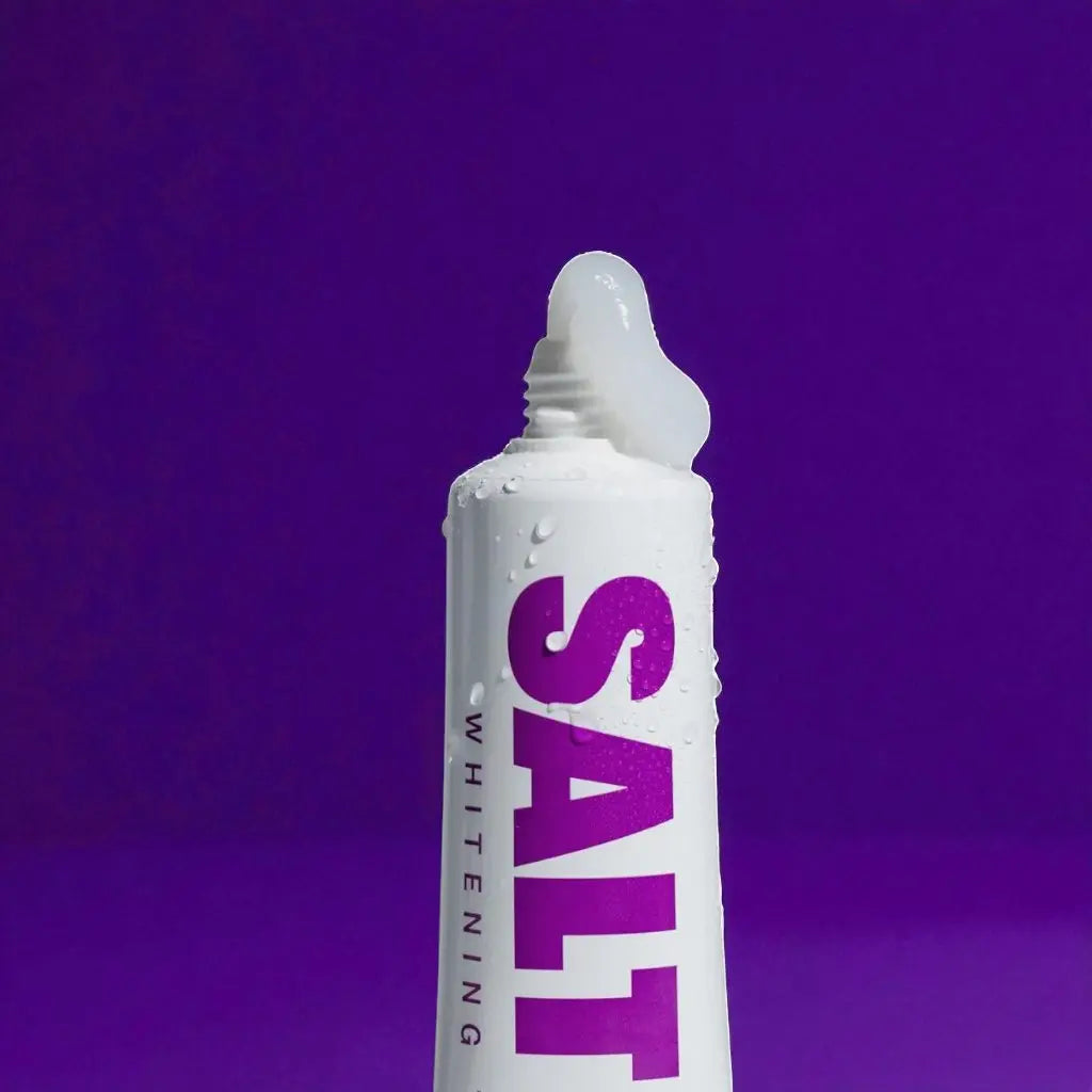 Saltrain toothpaste tube on a purple background