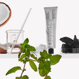 Davids Premium Natural Toothpaste - Charcoal and Peppermint displayed on shelf in a lab