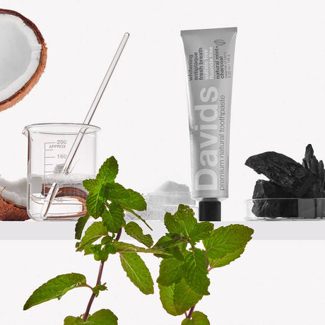 Davids Premium Natural Toothpaste - Charcoal and Peppermint displayed on shelf in a lab