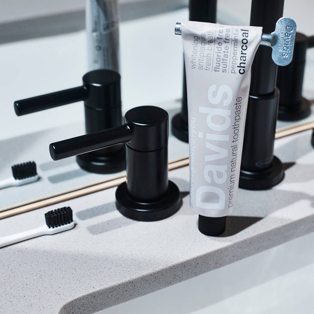 Davids Premium Natural Toothpaste - Charcoal and Peppermint flavour tube with key