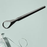 Davids professional tongue scraper on a light blue background