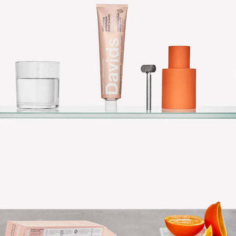 Shelf with Davids Natural Toothpaste Herbal Citrus Mint tube