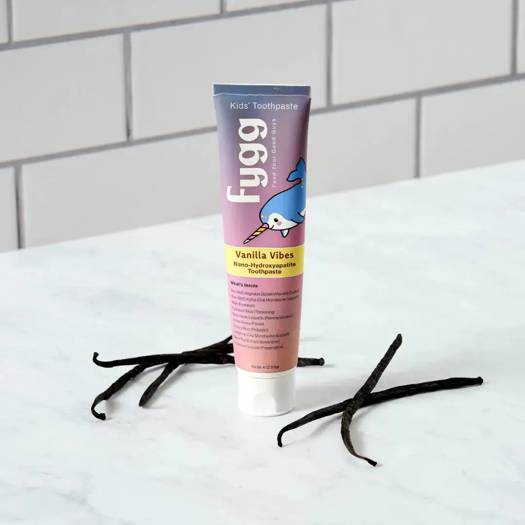 Fygg kids toothpaste tube with vanilla beans on a white surface