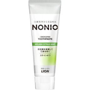 Tube of NONIO medicated toothpaste with green and white design on a white background