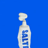 Saltrain toothpaste tube with blue text on a blue background
