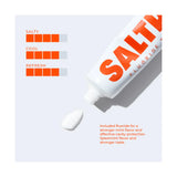 Saltrain fluoride toothpaste tube on a light grey background