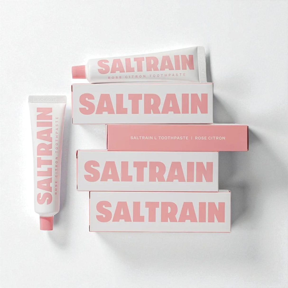 Collection of Saltrain toothpaste and boxes on a white background