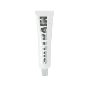 Saltrain toothpaste tube with black text on a white background
